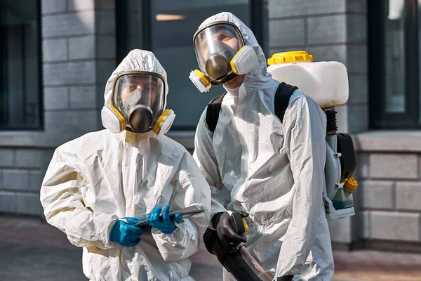 Portrait of workers in hazmat suits. time to protect yourself, stay at home — Stock Photo, Image