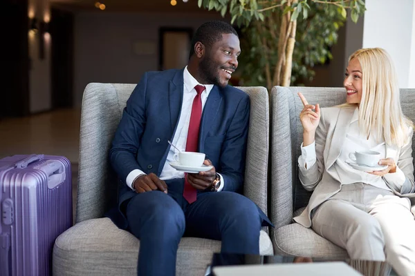 mixed race couple have lunch in restaurant