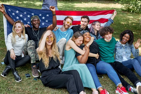 friendly happy youth on grass in the park