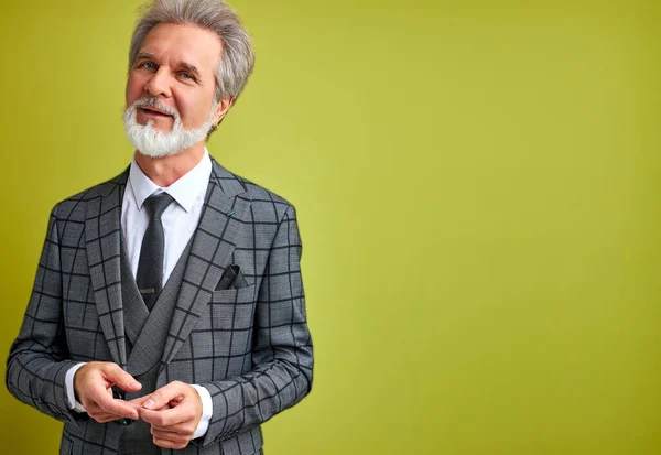 open-minded businessman in suit isolated over green background