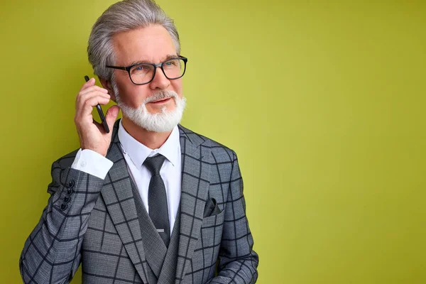 pleasant businessman talk on phone with business partner