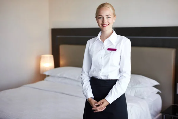Positive hotel staff in room — Stock Photo, Image