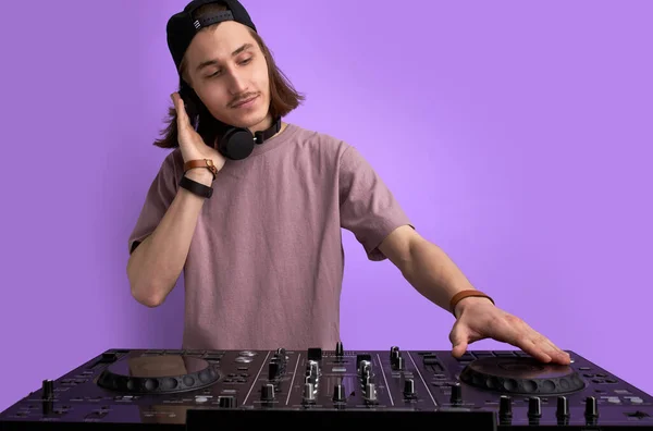 modern club DJ playing mixing music on vinyl turntable, isolated