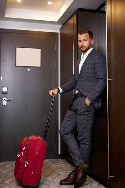 good-looking guy going to leave hotel room