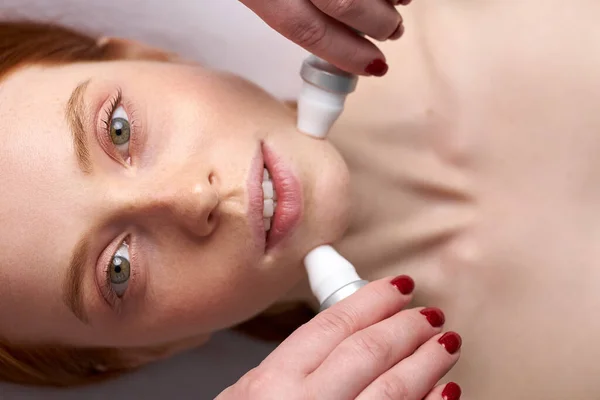 Closeup photo of girl having face polishing procedure — Stock Photo, Image