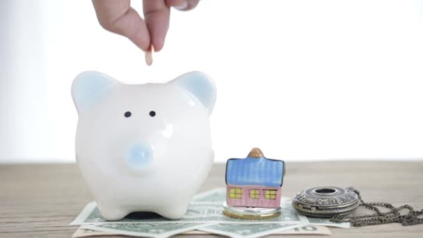 Close Hand Putting Coin Piggy Bank Bit Coin — Stock Video