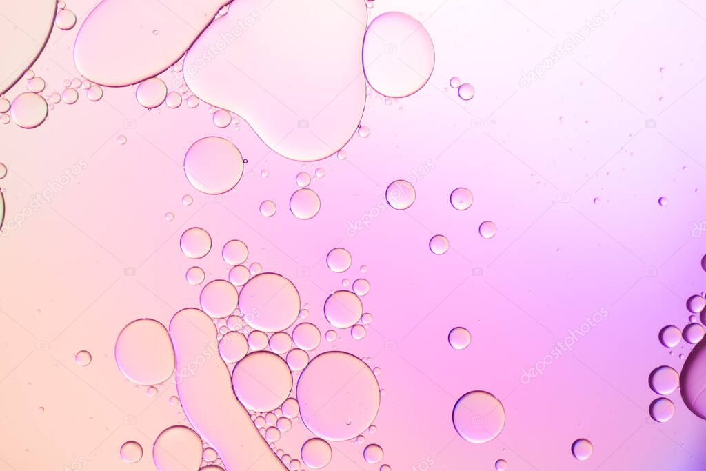 Colorful artistic of oil drop floating on the water. Pastel color bubble for background.
