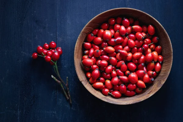 Freshly Picked Rose Hips Wooden Bowl Black Surface — Stock Photo, Image