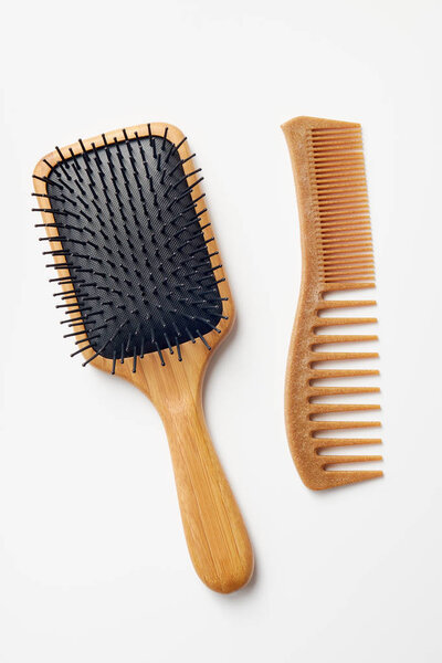 Bamboo Comb and Hairbrush On White Background