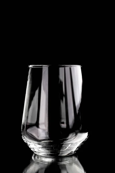 Glass empty beaker with highlights on black background — Stock Photo, Image