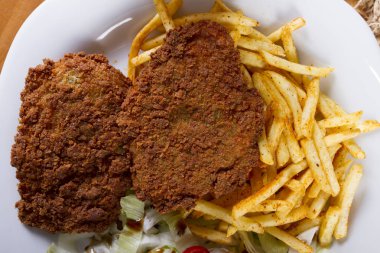 Wiener şinitzel veya Wienerschnitzel'e İsviçre, çok ince, tava ve kızarmış pirzola Dana gelen pan. Şnitzel et, genellikle tarafından vurma kızarmış et sirke ile inceltilerek olduğunu.