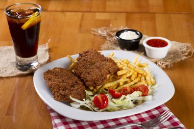 Wiener şinitzel veya Wienerschnitzel'e İsviçre, çok ince, tava ve kızarmış pirzola Dana gelen pan. Şnitzel et, genellikle tarafından vurma kızarmış et sirke ile inceltilerek olduğunu.
