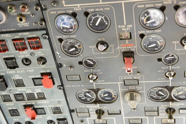 Airplane Pilot\'s Cockpit with Center Control Panels. Closeup high detailed view on engine power control and other aircraft control unit in the cockpit of modern civil passenger airplane.