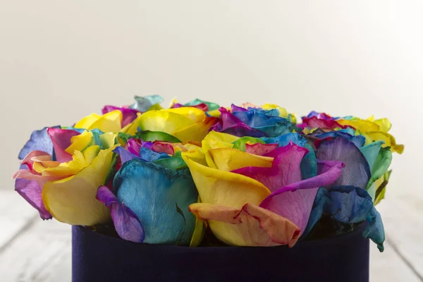 close up view of painted colorful bouquet of roses