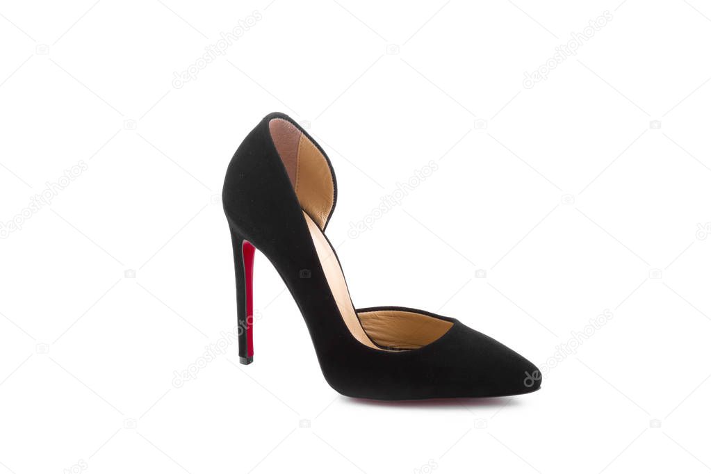 close up view of female high heel shoe on white backdrop