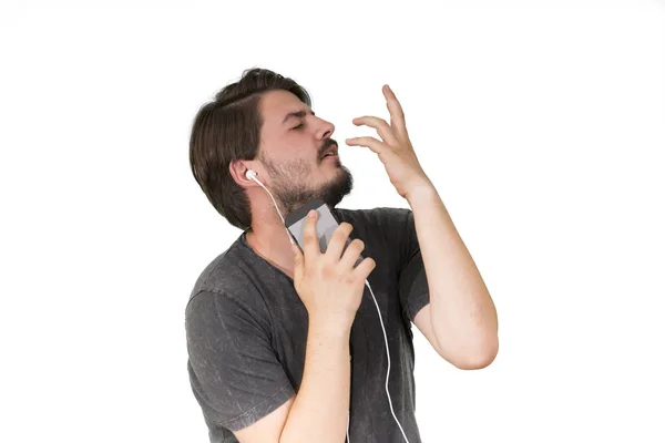 Man Oortelefoons Met Smartphone Luisteren Muziek Geïsoleerd Witte Achtergrond — Stockfoto