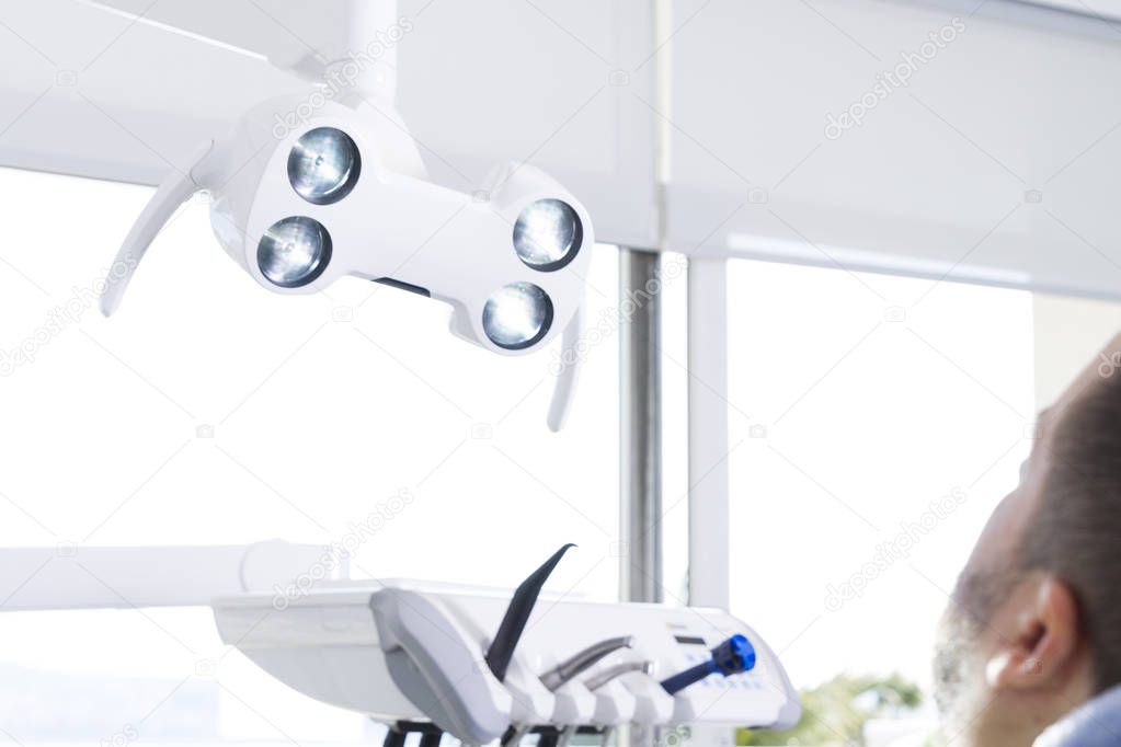 male patient waiting for dentist in dental clinic