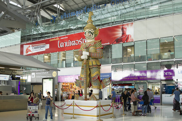 BANGKOK , THAILAND MAY 14, 2017 : Passengers looking at flights information board in Suvarnabhumi Airport International Terminal, Bangkok