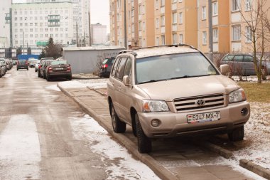Minsk, Belarus -  March 14, 2019: Parking violation on walkways, lawns, crosswalks, no parking signs, public transportation stops. clipart