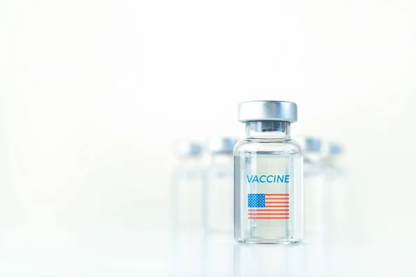 Transparent vials with USA flag. Vaccine for covid-19 coronavirus, flu, infectious diseases. Injection after clinical trials for vaccination of human, child, adult, senior. Medicine, drug concept.