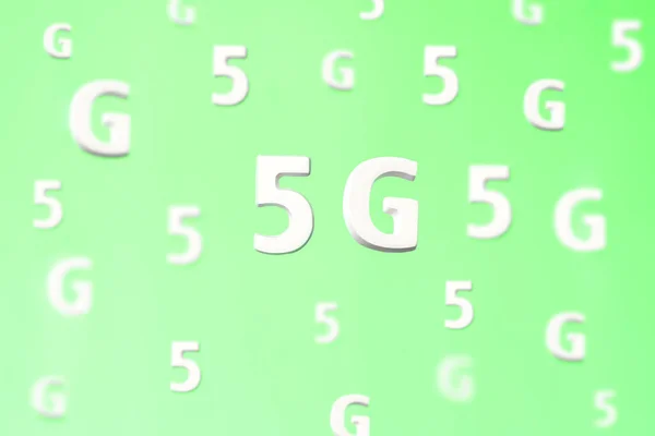 Pattern with large white flying letters 5 G on green background. Creative concept. Modern wireless high speed mobile internet. Connection technology for cell, laptop,phone. Use at home, work,business.