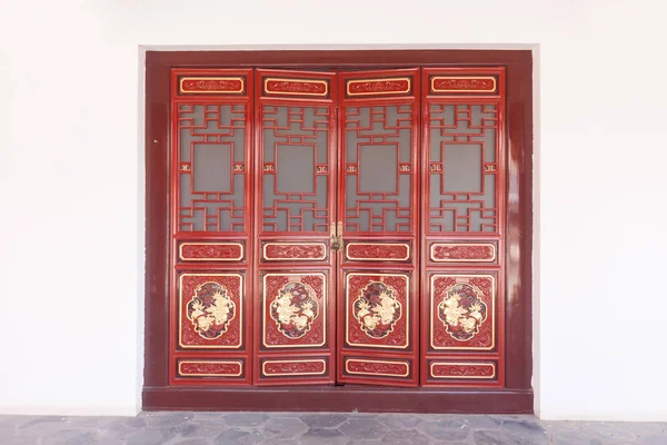 Gateway with red Chinese doors.