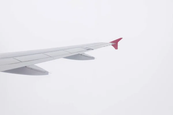 Wing of airplane on white background. — Stok fotoğraf