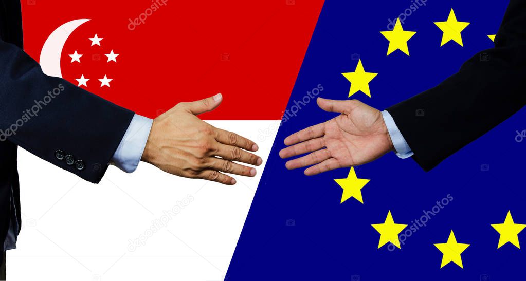A business man shake each other hand,Singapore and EU