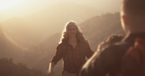 Active retired woman hiker posing for photo on mountain top — Stock Video