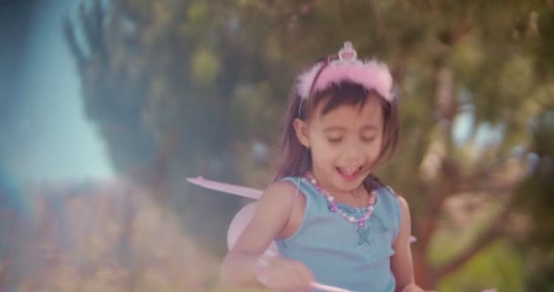 Cute little Asian girl in fairy costume playing make-believe — Stock Video