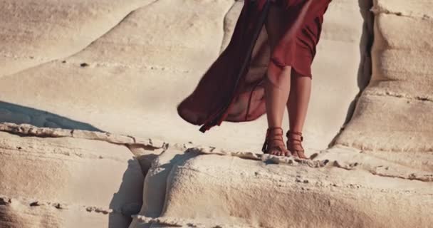 Hippie woman with foil tattoo standing on white rock — Stock Video