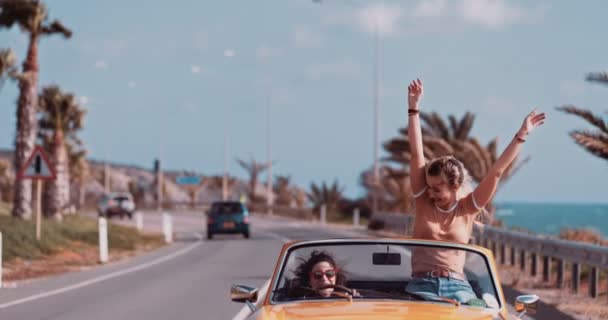 Women having fun and enjoying the sun in convertible car — Stock Footage Women having fun and enjoying the sun in convertible car Stock Video