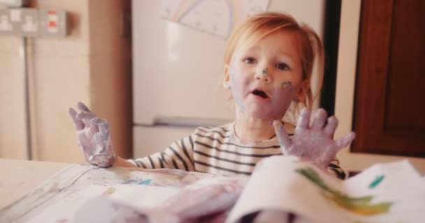 Frustrated child dirty with paints having a tantrum — Stock Video