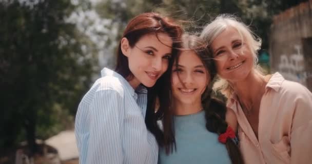 Portrait of smiling three-generation family of women outdoors in summer Royalty Free Stock Video