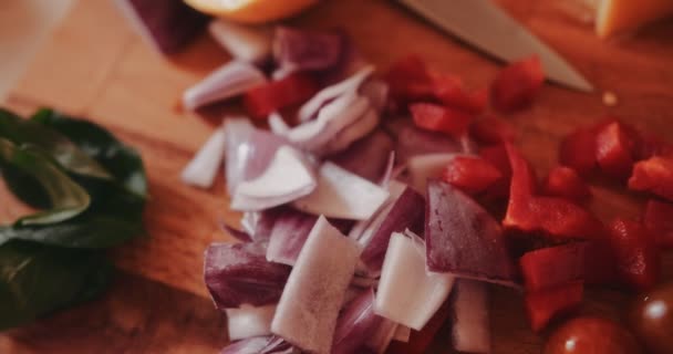 Close-up of fresh vegetables cut on wooden cutting board — Stock Video