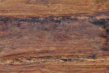 Arka plan koyu lekeler ile kaba ahşap yüzey
