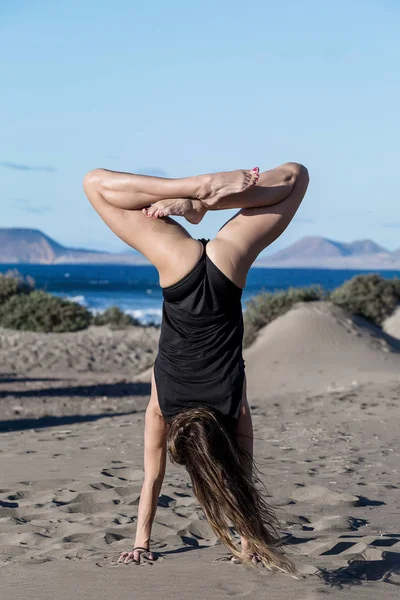 Back View Woman Upside Doing Handstand Asana Legs Crossed Beach — Stock Photo, Image