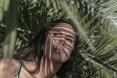 Woman with shadows on her face