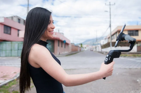 youtuber ecuadorian latina woman live with her followers on the street