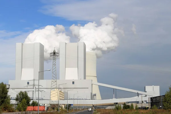 Power plant Liebenau with cloud of smoke over cattle towers