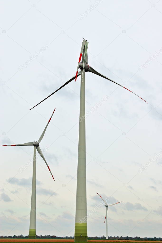 Windmill with broken rotor after storm