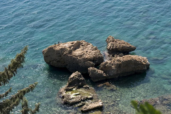 Rocks in the sea from top view.