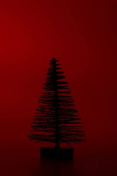 One Silhouette Artificial Pine Tree Red Background — Stock Photo, Image