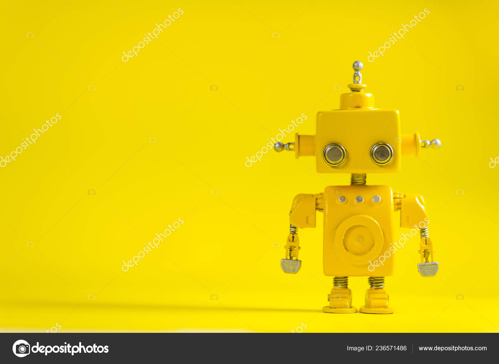 Cute Yellow Handmade Robot Yellow Background Stock Photo by ©casarda