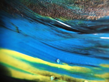 Mavi, yeşil ve sarı renkli soyut boya arka plan doku.