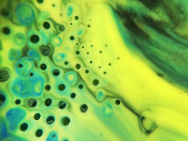 Mavi, yeşil ve sarı renkli ve noktalı soyut boya arka plan dokusu.