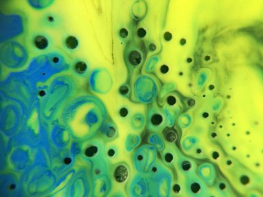 Mavi, yeşil ve sarı renkli ve noktalı soyut boya arka plan dokusu.