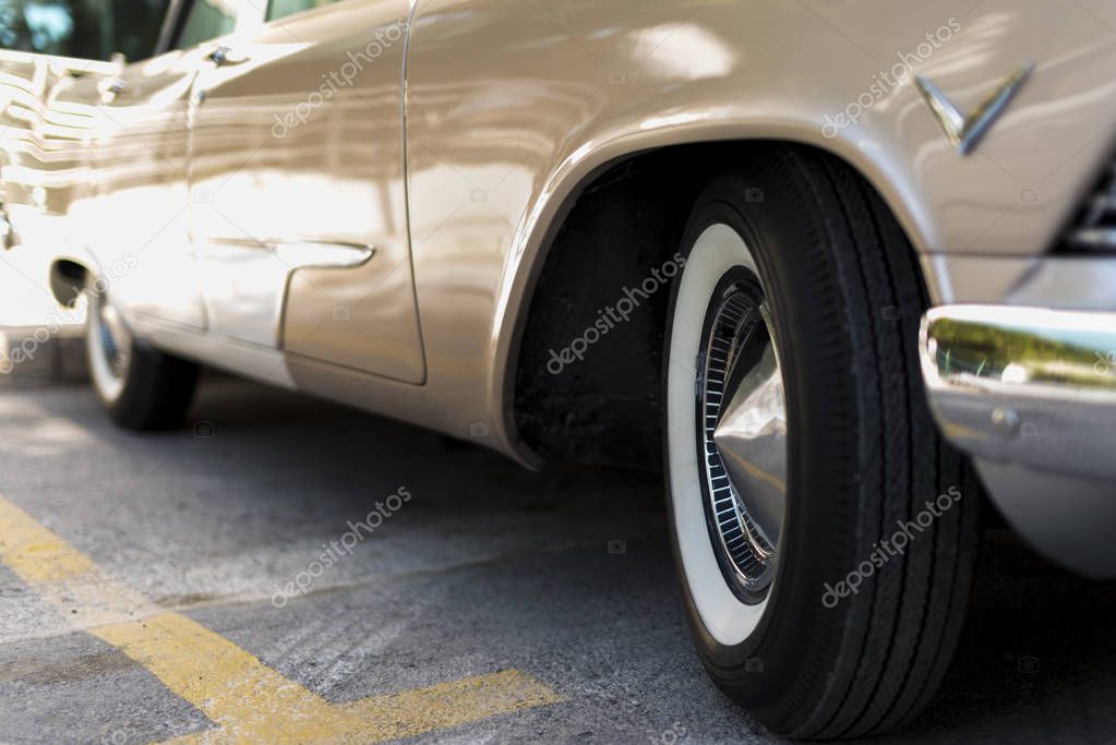 Izmir, Turkey - September 23, 2018: Front right wheel of a Beiege colored 1957 Plymouth Vintage car in Izmir Turkey.