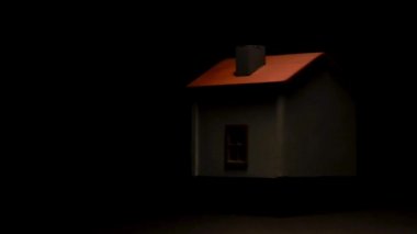 Siyah bir arka planda ve yüksek kontrast ile iplik model ev.