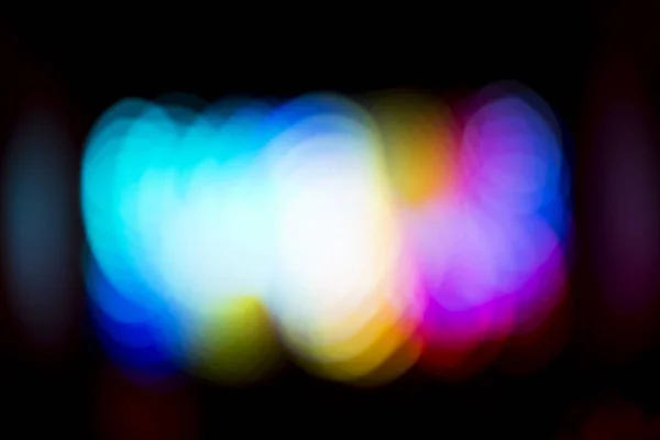 Bunte Bokeh-Lichter auf schwarzem Hintergrund. — Stockfoto